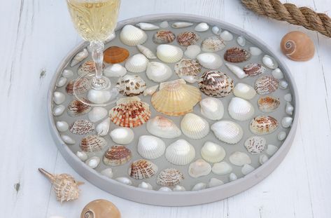 Turn a favourite collection of shells into a seaside-themed serving tray with this clever resin technique Resin Seashell Crafts, Seashell Resin Table, Seashell Coasters With Resin, Printers Tray With Shells, Shell Tray, Diy Resin Coasters, Round Wooden Tray, Beachcombing Finds, Sea Shell Resin Tray