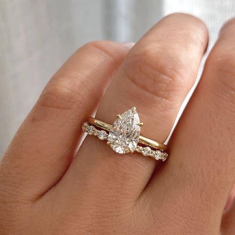 Wedding Rings To Go With Pear, Wedding Band With Teardrop Ring, Elegant Engagement Rings Pear, Wedding Bands And Engagement Rings Set, Pear Engagement Ring With Stacked Bands, Pear Ring With Gold Band, Minimal Diamond Engagement Ring, Pear Engagement Ring Gold Wedding Set, Simple Wedding Band For Pear Shaped Ring