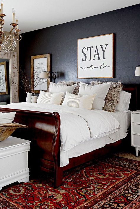 Whether you're working with a hand-me-down family heirloom or a vintage piece you scored for a bargain, decorating with wood furniture is all about achieving a balance. Use these tips on how to decorate with wood furniture to style old pieces with an updated look. #howtodecoratewithwoodfurniture #thrifted #fleamarketfinds #bedroomdecor #bhg Wood Furniture Bedroom Decor, Cherry Wood Bedroom, Wood Bedroom Decor, Dark Wood Bedroom Furniture, Cherry Bedroom Furniture, Cherry Bedroom, Dark Wood Bedroom, Dark Wood Bed, Dark Bedroom Furniture