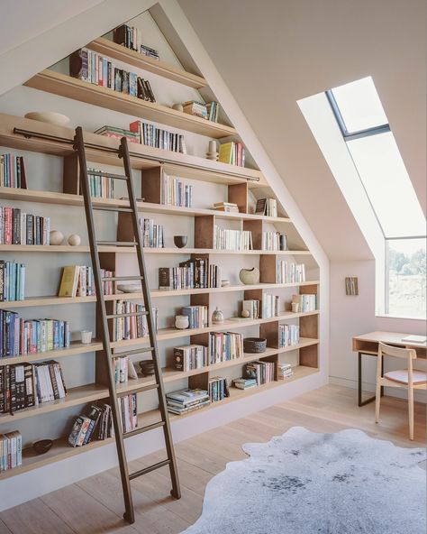 Introducing the statement bookcase from our recent House in Surrey project📚 Custom joinery transforms this attic nook into a bibliophile’s dream, perfectly fitted under the vaulted ceiling. It’s the ultimate cosy reading corner that combines practicality with a love for design! Handcrafted by @endgrainltd . . . . #bookcase #custombookcase #bespokebookcase #joiners #joinery #carpenters #carpentry #highendjoinery #bespokejoinery #joineryworkshop #joinerydesign #custommade #woodworking #wea... Double Height Bookshelf, Loft With Bookshelves, Builtin Bookshelves Vaulted Ceiling, Built In Bookshelf With Ladder, In Home Library With Ladder, Vaulted Ceiling Shelving, Floor To Ceiling Bookcases Built Ins, Built In Bookshelves Tall Ceiling, Bookcase Vaulted Ceiling