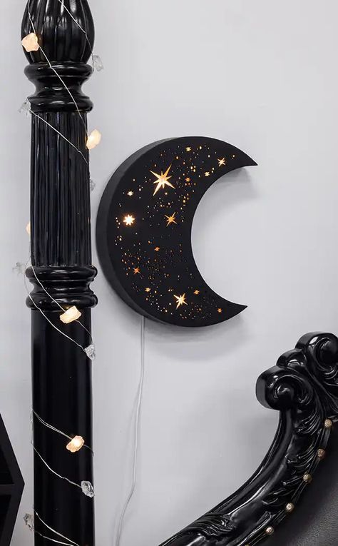 This gorgeous crescent moon celestial lamp has been designed with stars of different sorts to depict the magic of the night sky. This lamp has a hook to hang on any wall to add a lush magical light to any room. It runs on a USB cable to make it easy to keep going without the environmental nightmare of using batteries. The beautiful warm soft glow from these helps create a relaxing atmosphere and adds a bit of celestial magic to any room. Dimensions: 24.8cm x 21cm x 3.7cm Made from wood.