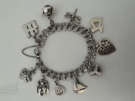 Beautiful 8” Light Double Curb James Avery Sterling Charm Bracelet Retired Teapot, Sailboat, etc.!. All 10 James Avery charms on the bracelet include the following: retired 3 Kings on a temporary jump ring, retired teapot on a temporary jump ring, dragonfly, Heart Texas, retired Love is on a temporary jump ring, retired Southwestern bird/chicken, retired sailboat, Jack-o-lantern on a temporary jump ring, guardian angel w/children on a temporary jump ring, retired Noah’s ark on a temporary jump ring. Rarely/gently worn. I used the temporary jump rings to be able to change out charms when I wanted to. Any James Avery store can easily permanently weld the charms to the bracelet if so desired. 10 total charms. *Will send signature required. James Avery Charm Bracelet Aesthetic, James Avery Charm Bracelet, Pandora Bracelet Charms Ideas, James Avery Charms, 3 Kings, Bracelets Collection, Noah S Ark, 2024 Christmas, Bracelet Charms