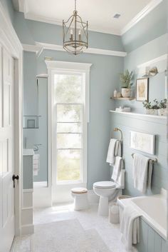 Dive into the daily routine of an interior designer as they create a coastal modern bathroom look featuring the stunning paint color SW Anchors Aweigh (SW 9179). #Ad #homedecor #homedesign #bathroom #Painthome interiorarchitecture best Wall Colors for Bathroom Colors Bright Room Colors best colors combinations bathroom bathroom Remodeling Modern Paint Colors 2024 Light Blue Restroom Ideas, Wherein Williams Bathroom Colors, Light Blue Paint For Bathroom, Bathroom With Light Blue Walls, Bathroom Bright Colors, Color Combinations For Bathrooms, Bathroom Light Blue Walls, Sw Lullaby Paint Bathroom, Sw Morning At Sea