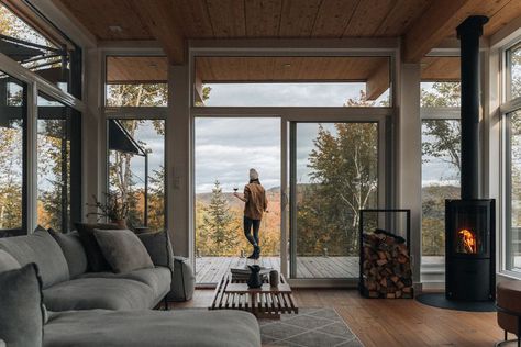 Are Wood Stoves and Big Windows Still the Stuff That Dreams Are Made of? Wood Stove In Front Of Window, Modern Woodstoves, Wood Stoves Ideas Living Rooms, Big Windows Living Room, Maine Cabin, Cottage Fireplace, Nature Living, Bespoke Bathroom, Cowboy Ranch