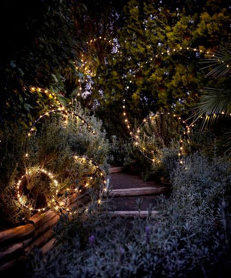 If you’re looking for a quick and affordable way to jazz up your backyard, try your hand at one (or all) of these whimsical lighting ideas to illuminate your outdoor space. Apartment Hacks, Outdoor Fairy Lights, Backyard Lighting, Moon Garden, Magical Garden, Garden Cottage, Landscape Lighting, Dream Garden, Garden Lighting