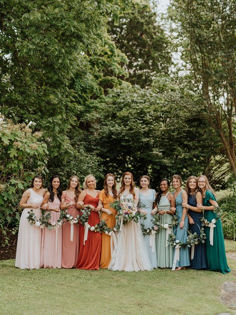 Rainbow colorful mismatched bridesmaid dresses Muted Rainbow Wedding, Rainbow Bridesmaid Dresses, Rainbow Bridesmaids, Bridesmaid Dresses Mismatched, Rainbow Wedding Theme, Summer Weddings Bridesmaids, Summer Bridesmaid Dresses, Wedding Party Outfits, Bridesmaid Attire