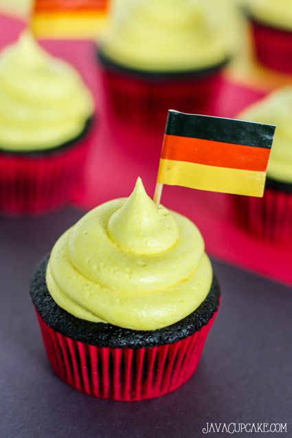 Germany Cupcakes - Black, red and yellow themed cupcakes perfect for your next German themed party! | JavaCupcake.com German Themed Party, Germany Party, German Party, Oktoberfest Party, Strawberry Filling, Themed Cupcakes, German Food, Red And Yellow, Cupcake Recipes