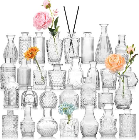 STURDY AND THICK GLASS---30 pcs bulk bud vases are made of high quality thick and strong glass,which are durable and not easy to break. The bottom is non-slip and the center of gravity is stable. These petite little vases were perfect for wedding tables and also be reused for any other table decor or home decor. You can also add some dried flowers or aromatherapy sticks to the vase. ALL UNIQUE DESIGNS AND DIFFERENT SHAPES AND SIZES. Shapes and heights (3-5.5 inches) Vasos Vintage, Vases For Centerpieces, Wedding Table Decorations Centerpieces, Glass Vases Centerpieces, Vases For Flowers, Small Glass Vases, Tafel Decor, Glass Bud Vase, Clear Vases