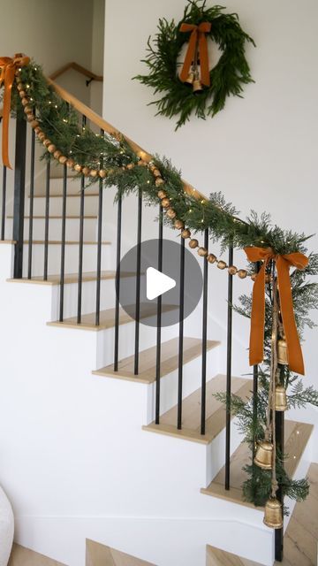 Kasey Dixon on Instagram: "HOLIDAY \ Christmas staircase styling!✨ Layering all the garland, gold beads and mini lights with velvet bows and bells!🔔🔔 SO many great finds from Target and Amazon in this setup! Happy decorating! Here are 3 easy ways to SHOP👇🏻 1. Comment “shop” to get links sent directly to your DMs 2. Click the link in my bio @sbkliving and select “shop my reels” 3. Head over to my @shop.ltk shop and follow me “sbkliving” #holidaydecorating #christmasdecor #christmasdecorating #christmasstyling #christmasgarland #amazonhome #christmasdecoration #targethome" Outdoor Stair Railing Christmas Decor, Garland With Bows Christmas, Decorating A Bannister For Christmas, Simple Christmas Staircase, Banister Ideas Christmas, Garland Stairs Christmas, Simple Banister Christmas Decor, Banister Decorations For Christmas, Decorating Banisters For Christmas