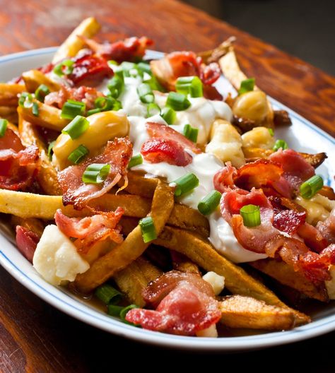 There's a great poutine shop in Toronto called Poutini's. My favourite poutine they is called The Works. It's bacon, sour cream and green onion on poutine. I... Poutine Recipe, Fries Recipe, Canadian Food, Poutine, French Fries, Green Onions, Potato Recipes, The Works, Food Cravings