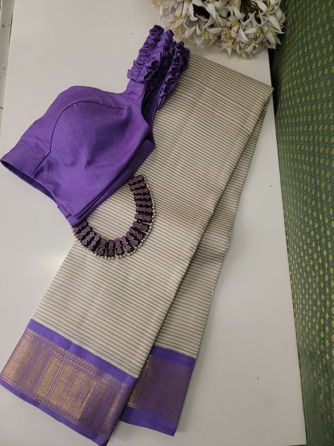 Beige and grey striped handwoven Kanchipuram silk saree with lilac Korvai border crafted in gold zari featuring intricate geometric patterns and Rudrakshams. The pallu is in lilac with paisleys, Mayil and geometric pattern in gold zari. This saree combines the opulence of Kanchipuram silk with Korvai border, making it a perfect choice for any traditional occasions. Blouse: Lilac Kanchipuram silk with zari motifs and Korvai border Unique Kanchipuram Silk Saree, Korvai Silk Sarees, Korvai Silk Sarees Kanchipuram, Lilac Silk Saree, Pattern Blouses For Sarees, Striped Blouse Designs, Saree Combination, Exclusive Saree Blouse Designs, Silk Saree Blouse Designs Patterns