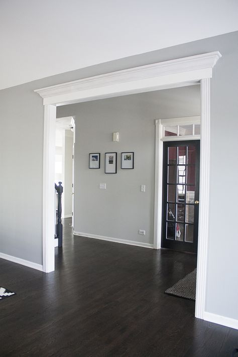 Benjamin Moore Gray Owl | you're so martha Benjamin Moore Gray Living Room, Gray Foyer Entryway Paint Colors, Grey Tint Benjamin Moore, Shiplap Grey Wall, Bm Owl Gray, Gray Walls With Hardwood Floors, Interior Paint With Dark Wood Floors, Living Room Hallway Paint Wall Colors, Wall Color For Living Room With Gray Furniture