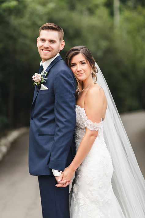 Bride wearing off the shoulder lace wedding dress with cathedral veil in a beautiful up-do with natural glam makeup. Groom wearing Navy suit with white and pink boutonnière. Photo taken at Whistle Bear in Cambridge Ontario by Sandra Monaco Photography.  #WeddingPose #VeilInspiration #CandidPosing #Posing #CouplePose #CandidWedding #Elegant #Romanticposing #PosingInspiration #CouplesPosing #RomanticWedding #WalkingPose #OffShoulderWeddingDress #WeddingDressInspo #WhistleBear Bride And Groom Classic Poses, Chest To Chest Wedding Pose, Bride Behind Groom Wedding Photos, Wedding Bridal Picture Ideas, Formal Bride And Groom Photos, Bridal And Groom Poses, Wedding Photos Poses Bride And Groom, Bride Pictures Ideas Wedding Day, Wedding Formal Portraits