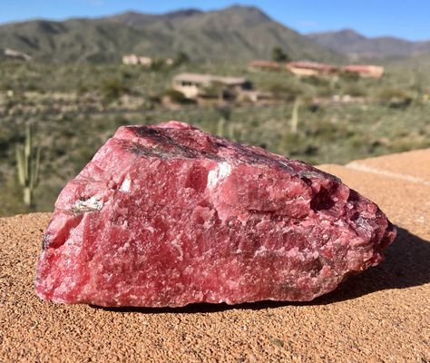 Shown above is a chunk of gem grade rhodonite. Rhodonite is a manganese rich pink gemstone which forms near silver deposits. We plan to turn this material into several cabochons for use in jewelry. #rhodonite #gem #pink #gems #gemstone #crystal #crystals Rhodonite Jewelry, Stones Aesthetic, Aesthetic Pink, Pink Gemstones, South American, Geology, Precious Stones, Red Color, Gems