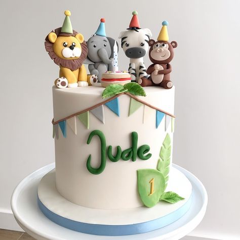 Celebrating Jude’s 1st trip around the sun with this sweet safari animal cake! 🎂 💚 A delicious lemon flavoured cake decorated with handmade fondant safari animals all wearing their party hats ready to celebrate! 🥳 🦁 🐘 🦓 🐵 After having made Jude’s Christening cake last year, it’s a privilege to have now made his 1st birthday cake! I love when my cakes play a part in your milestone celebrations! Here’s to many more joyful years ahead 🎈 #safaricake #partyanimalscake #junglepartycake #1stbir... Birthday Cakes For Baby Boys 1st, Jungle 2nd Birthday Cake, 1 Year Bday Cake, Animals Cakes Birthday, 1 Year Birthday Cake Ideas, Baby Boy First Birthday Cake Ideas, Safari Cake Birthday, Birthday Cake 1 Year Boy, Cake Safari Birthday