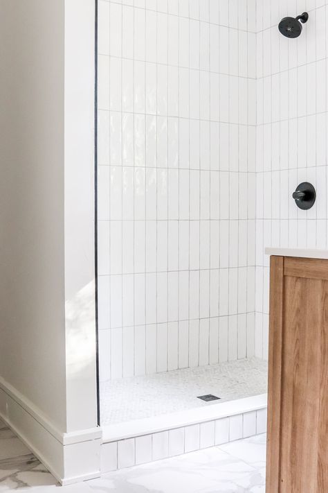 Tile Over Shower Pan, White Subway Tile Shower Ideas Small Bathrooms, Walk In Shower Vertical Tile, Verticle Subway Shower Tile, Small Subway Tile Bathroom, White Vertical Shower Tile, Penny Tile Shower Floor Ideas, Shiplap And Subway Tile Bathroom, White Vertical Subway Tile Bathroom