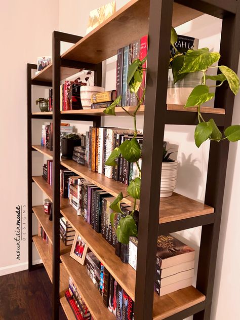 Industrial style bookshelf with black painted ladder uprights and plywood shelves. Side By Side Bookshelves, Diy Open Shelf Bookcase, Bookshelf Wood Design, Double Sided Bookshelf, Backless Bookshelf, Diy Wood Bookshelf, Bookshelf Hallway, Free Standing Bookshelves, Double Bookshelf