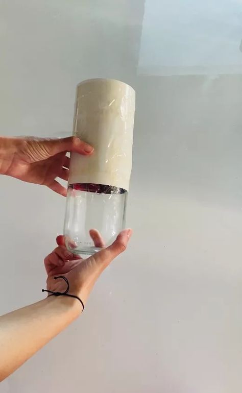 This DIY concrete &glass vase is very easy and cheap to make. Let me show you how. Materials you will need to make this project:-glass bottle, i used a milk bottle-tape-concrete mix-sanding paper Take a glass bottle.  Cut some cardstock and wrap it around the jar neck. Fix the cardstock on the jar with some tape (vertically and horizontally) Put some tape or some paper inside the jar to prevent the concrete from dripping inside your container. Mix the concrete with wat… Mini Candle Holders, Bottom Of The Bottle, Diy Concrete, Shelf Liner, Mini Candles, Diy Vase, Small Jars, Tall Vases, Concrete Diy