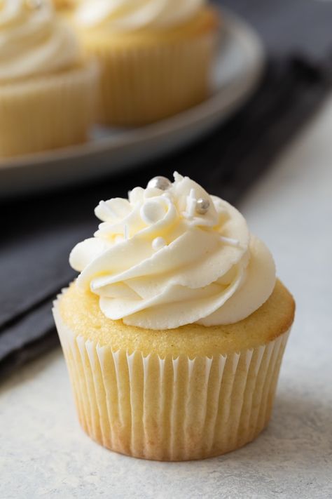 Tender vanilla cupcakes topped with vanilla buttercream frosting. This homemade vanilla cupcake recipe is suitable for any occasion. Best Vanilla Cupcakes, Best Vanilla Cupcake Recipe, Basic Cupcake Recipe, Homemade Vanilla Cupcakes, Pudding Cupcakes, Vanilla Cupcake Recipe, Homemade Cupcakes, Vanilla Buttercream Frosting, Vanilla Cake Recipe