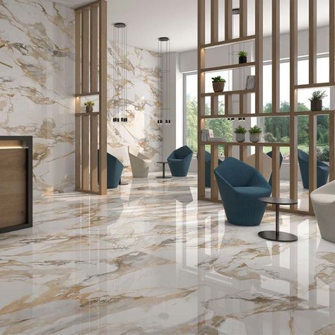 Arezzo Gold marble effect porcelain tiles.A unique and very elegant tile with a wonderful polished finish and very distinctive gold veining on a white background.  This timeless and distinctive tile is ideal for bathrooms and floors and is available in a range of sizes.Consider 1200 x 600mm on the wall and 600m x 600mm on the floor in a bathroom.  If you want to create the “WOW “factor this tile should be seriously considered,a tiled floor is simply stunning. Living Room Floor Tiles, Bedroom Tile, Tiles Living Room, Floor Tiles Design, Marble Flooring Design, Tile Floor Living Room, Escalier Design, Elegant Tiles, Marble Floors