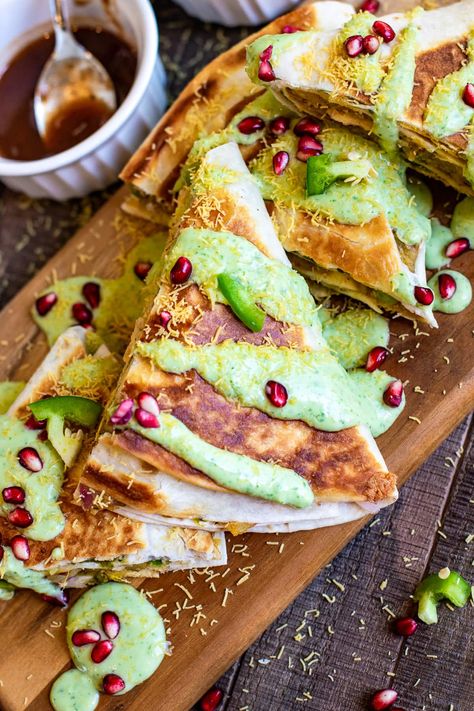 This Samosa Chaat Crunch Wrap recipe is my fun spin on the very popular Indian samosa. All the flavors of a samosa tucked in a wrap, but healthy. It is a delightful Indian Mexican fusion recipe for your next meal or a party. #fusionrecipe #samosa #chaat Masala Corn, Mango Panna Cotta, Samosa Chaat, Iranian Recipes, Crunch Wrap, Samosa Recipe, Indian Appetizers, Fusion Dishes, Corn Dip