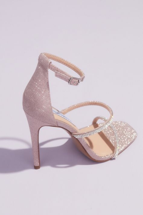 This stiletto from our exclusive Steve Madden x DB collection is fit for a bride! This megawatt sparkling pair of heels features dainty crystal encrusted straps and is covered with a gorgeous blush toned glitter. The high-shine on these wedding shoes means you’ll sparkle all night long! | Style KEYLA | Shop the designer wedding shoes collection in select David’s Bridal locations or online at davidsbridal.com | #stevemadden #stevemaddenshoes #weddingshoes Quinceanera Shoes, Shoes Heels Prom, Pageant Shoes, Elegant Wedding Shoes, Hak Tinggi, Blush Heels, Pink Wedding Shoes, Shoes Heels Classy, Wedding Shoes Bride