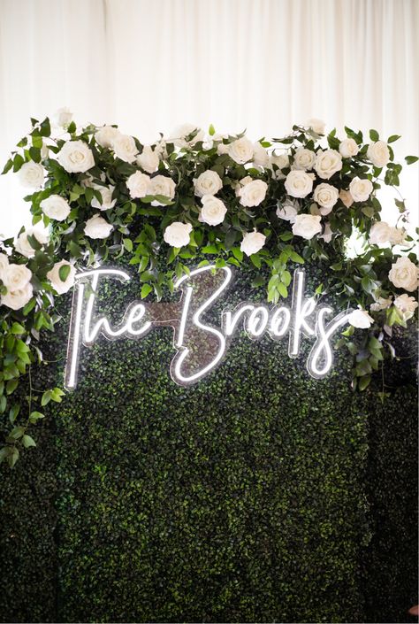 Neon on sign in our wedding Backdrop With Neon Sign Wedding, Backdrop Ideas Wedding Receptions, Wedding Green Backdrop, Neon Sign Wall Wedding, Wedding Wall With Neon Sign, Flower Photo Wall Wedding, Neon Sign For Wedding Backdrop, Indoor Wedding Reception Aesthetic, Neon Wedding Signs