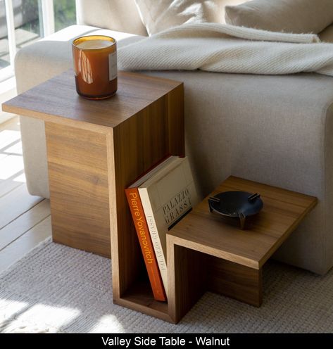 The Ojai Valley Side Table in Walnut is designed to create interest in the eye of the viewer. With its tiered levels, geometric build, sleek structure, and built-in magazine rack, the piece delivers at every angle.  Our Valley Side Tables are made of walnut veneer. The reason we opt for veneer for this piece is to achieve a thinness in design that would not be possible using solid wood, as solid wood would bend and warp when exposed to changes in Side Table Oak, Wood Furniture Design Living Room, Simple Wood Decor, Modern Wood Side Table, House Decor Inspo Living Rooms, Wood Decoration Ideas, Bed End Table, Furniture Design Wood, Simple Side Table