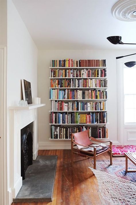 8 Spaces that Make Track Shelving Look Good | Apartment Therapy Track Shelving, Home Libraries, Open Shelves, Home Library, A Living Room, Book Shelf, My New Room, 인테리어 디자인, Open Shelving