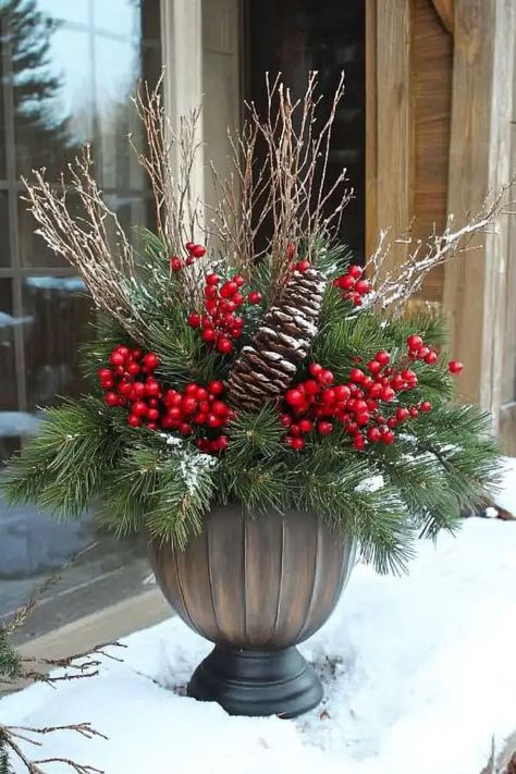 29 Winter Planter Ideas to Transform Your Outdoor Space This Season Outdoor Planter Winter Ideas, Decorate Planters For Christmas, Outdoor Christmas Planters Farmhouse, Outdoor Winter Urn Arrangements, Christmas Plants Outdoor, Winter Porch Pots Christmas Arrangements, Christmas Greenery Pots Front Porches, Winter Outdoor Pot Arrangements, Winter Urn Planter Ideas