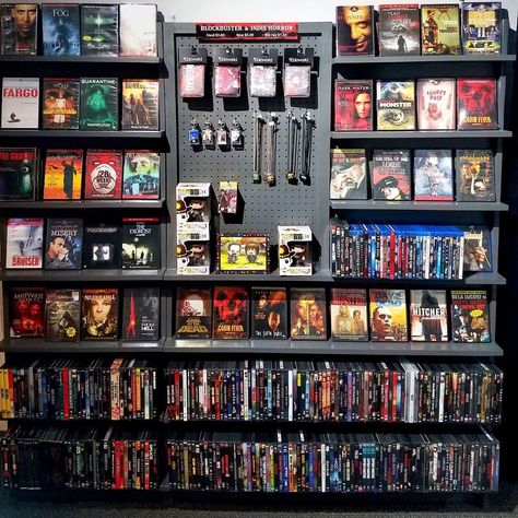 Horror Movie Theater Room, Horror Movie Shelf, Movie Shelf Aesthetic, Movie Collection Display, Diy Dvd Shelves, Comic Shelf, Dvd Wall, Movie Shelf, Diy Reclaimed Wood Wall