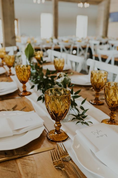 Burnt Orange Tablescape, Goblet Wedding Table, Vintage Glass Wedding, Water Goblets Table Settings, Sage Green And Amber Wedding, Amber And White Wedding, Vintage Glasses Wedding, Amber Centerpiece Wedding Ideas, Amber And Emerald Wedding