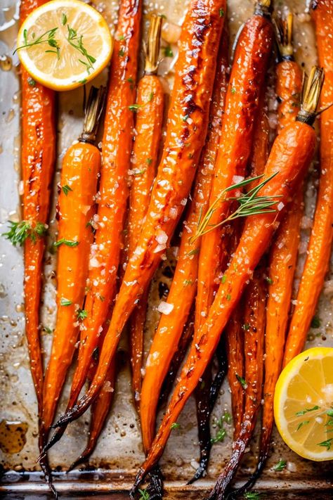 Got 30 minutes? That's all it takes for these oven-roasted maple carrots! Perfectly caramelized, with a hint of brown sugar sweetness, these carrots are the ultimate holiday side. Easy prep, unforgettable taste. Click for this quick, delicious recipe! Balsamic Glaze Carrots, Carmalized Carrots Oven, Roasted Glazed Carrots Recipe, Roasted Carrot Sticks, Healthy Baked Carrots, Quick Roasted Carrots, Roasted Carrots With Maple Syrup, Fall Roasted Carrots, Best Roasted Carrots Recipe