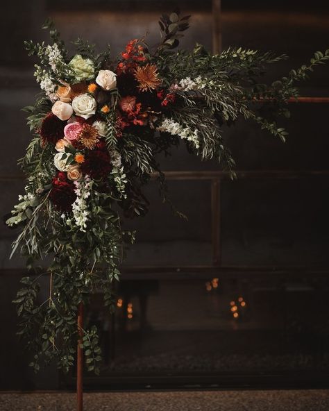 Erin Meadows on Instagram: “These stunning flowers from a wedding last year are both moody and romantic. Shoutout to @westvirjeni for doing such an incredible job.” Moody Terracotta Wedding, Moody Wedding Flower Arch, Moody Romance Wedding Centerpieces, Moody Floral Centerpiece, Moody Floral Wedding Arch, Moody Wedding Arbor, Dark Modern Wedding Decor, Dark And Moody Reception, Moody Romantic Wedding Florals