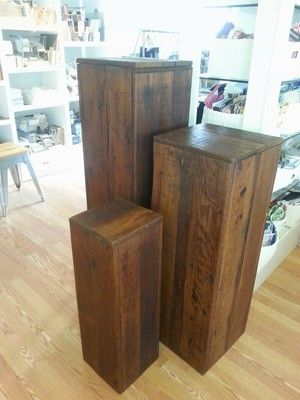 Trio of wooden pedestals. Seen here ready for use as a retail display. Diy Display Pedestal, Wooden Pedestal, Diy Wooden Pedestal Stand, Wedding Podium Ideas, Wooden Plinth, Diy Wedding Pedestals, Wooden Stands Display, Wooden Pedestal Stand, Diy Retail Display