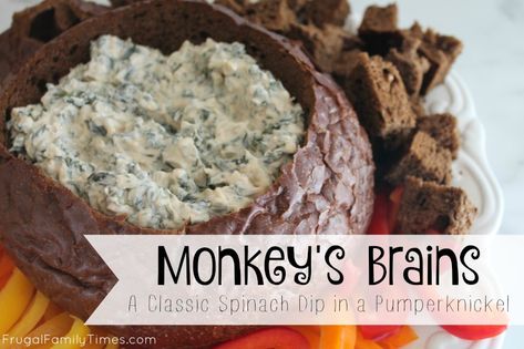 A Classic Party Recipe: Monkey's Brains - or Spinach Dip in a Pumpernickel loaf - which is a way more boring name.  So easy and crowd pleasing!  Great for parties and potlucks. Pumpernickel Bread Spinach Dip, Spinach Dip With Pumpernickel Bread, Spinach Artichoke Dip Pumpernickel, Dip For Pumpernickel Bread, Spinach Dip Pumpernickel Bread, Pumpernickel Spinach Dip, Spinach Pumpernickel Dip, Spinach Dip In Pumpernickel Bread Bowl, Pumpernickel Bread Recipe Dip