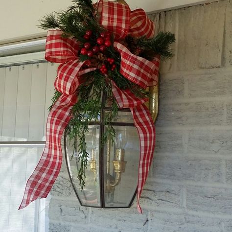 Christmas Carriage Light Decor, Bows On Outdoor Lights, Wreath On Garage Lights, Garage Light Christmas Swag, Outdoor Light Fixture Christmas Decor, Christmas Bows On Outdoor Lights, Garage Lights Christmas Decor, Outdoor Bows Christmas, Christmas Swag For Outdoor Lights