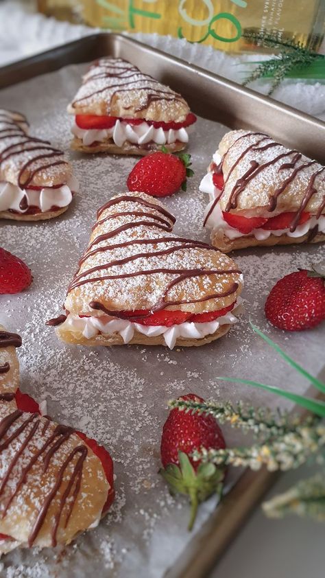 Strawberry cream puffs are delightful pastries filled with a luscious strawberry cream filling. Here's a description of these delectable treats: Pastry shells: The pastry shells are made from choux pastry, a light and airy dough that puffs up when baked. The dough is prepared by combining flour, butter, water, and sometimes eggs. It is then piped onto a baking sheet and baked until golden and crispy on the outside while remaining hollow on the inside. The result is a delicate and crispy shell Strawberry Cream Puffs, Strawberry Cream, Think Food, Sweet Snacks Recipes, Whipping Cream, Valentines Food, Cream Puffs, Fresh Strawberries, Fun Baking Recipes