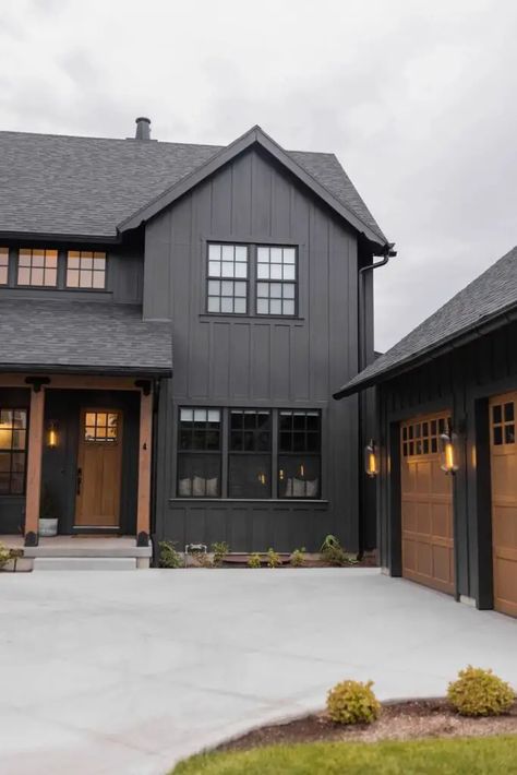 Black Siding Farmhouse Exterior, Black Siding Wood Accents, Wood Tone House Interior, Dark Cabin Exterior Colors, Black House Ideas Exterior Paint, Grey House Black Trim Wood Accents, Dark Brown House With Black Trim, Bold Home Exterior Colors, Everlast Siding Storm Grey