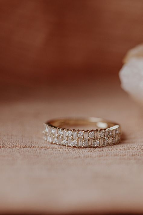 14k gold band with two rows of .53 cts of baguette and round diamonds, set in prongs in an alternating pattern. Available in rose, yellow, or white gold. Gold Baguette Ring, Baguette Diamond Ring, Ring Baguette, Baguette Diamond Rings, Baguette Ring, Round Diamond Ring, Dream Engagement Rings, To Infinity And Beyond, Unique Diamonds