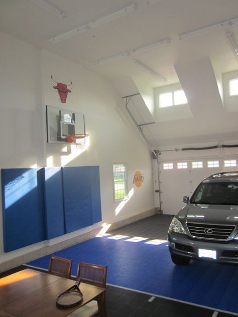 Basketball court in garage.  Not quite a half court, most of the 3 point line fits. The last issue of Houzz.com featured ideas for indoor basketball courts in your home.  I thought i would post a picture of our hoop in our garage (a 3 car tandem).  The Sport Court flooring has been awesome you just hose it off if it gets dirty. Home Basketball Court, Outdoor Basketball Court, Basketball Floor, Basketball Room, Basketball Tricks, Garage Addition, Indoor Basketball Court, Tandem Garage, Basketball Courts