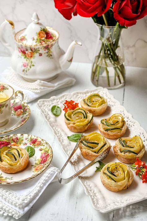 Rose Zucchini Tartlets are easy and elegant appetizers or teatime savories. They are simple to make with a handful of ingredients, such as puff pastry, zucchini, summer squash, olive oil, summer seasonings, and herbs. These bite-size appetizers are a delicious way to celebrate the season! Zucchini Tart Puff Pastries, Vegetarian Appies, Puff Pastry Zucchini, Easy Puff Pastry Appetizers, Zucchini Tart, Parmesan Squash, Savory Puff Pastry, Summer Appetizers Easy, Puff Pastry Appetizers