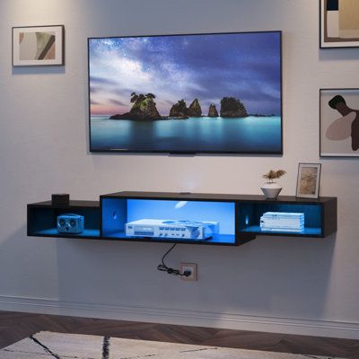 The floating TV shelf with LED lights provides cool and elegant blue lighting. With cool lighting, this wall mounted TV stand will bring better entertainment experience for your family to watch movies and play games. This space-saving floating entertainment center is perfect for living rooms and bedrooms. This wall mounted TV stand with power outlet and 79" supply cord is very convenient, which is perfect for your TV, DVD, WiFi router, mobile phone , tablet computer, etc. Recessed power strips a Floating Shelf Under Tv, Wall Mount Entertainment Center, Floating Tv Shelf, Wall Mount Tv Stand, Tv Stand With Led Lights, Floating Entertainment Center, Under Tv, Led Tv Stand, Floating Tv Stand