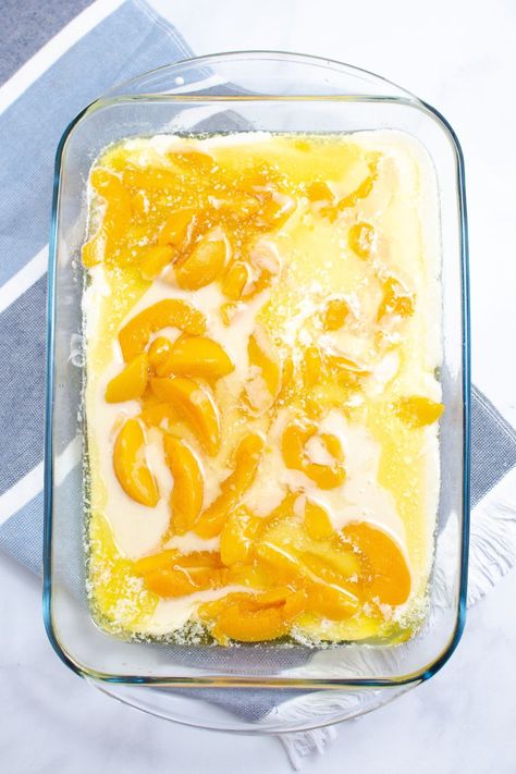 Peach Cobbler With Canned Peaches is an easy peach cobbler recipe that uses 5 ingredients. A quick dessert that is made from scratch and uses self rising flour, milk, butter and more. Don't wait and try this canned peaches cobbler today. A great throw together dessert for unexpected guests, potlucks, tailgating, and more. Peach Cobbler With Canned Peaches And Self Rising Flour, 3 Cup Cobbler, Easy Peach Cobbler Recipe 3 Ingredients, 4 Ingredient Peach Cobbler, Peach Cobbler With Self Rising Flour, Peach Cobbler Using Can Peaches, 8x8 Peach Cobbler Recipe, Old Time Peach Cobbler, Easy Canned Peach Cobbler Recipe