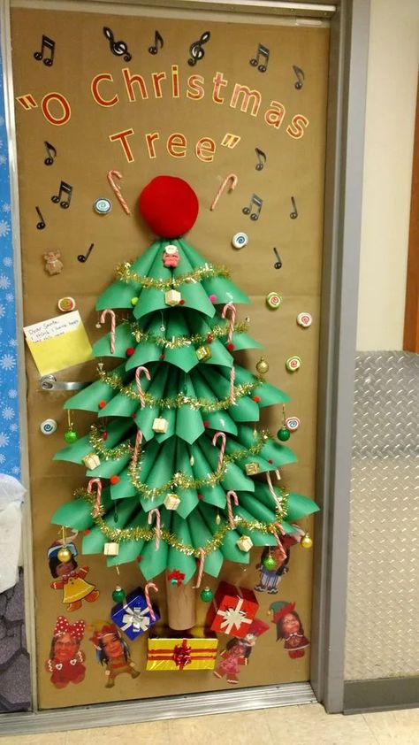 Over 40 DIY Christmas Door Decorations - A girl and a glue gun Christmas Tree On Door Classroom, Christmas Decoration Door School, Christmas Door Ideas School, Christmas Decoration For Office At Work, Classroom Xmas Doors, Paper Christmas Tree Door Decoration, Bulitin Board Ideas Christmas, Christmas Door Decorating Contest Apartment Diy, Rocking Around The Christmas Tree Door