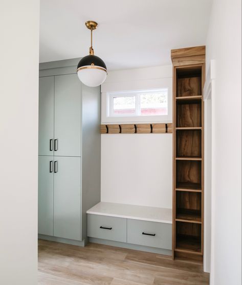 Sage green cabinets mix with wood shelves to create a functional + modern mudroom Sage Green Mudroom, Green Mudroom, Sage Green Cabinets, Modern Mudroom, Mudroom Ideas, Green Cabinets, Wood Shelves, Sage Green, To Create