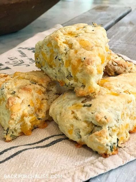 I’ve been experimenting with scones– both sweet and savory– and this is my favorite so far. Because, um, fresh rosemary. And cheese. This recipe* would be ideal for brunch during any season– Graduation, Wedding Shower, Easter or Christmas. I was able to use fresh rosemary from my garden, which makes me love them even more. They are also yummy paired with a soup or salad for an easy weeknight dinner. You can even split the batch and freeze half of them before baking. Preheat the oven… Rosemary Scones, Savory Scones Recipe, Fall Saturday, Cheddar Scones, Mini Scones, Cranberry Orange Muffins, Orange Muffins, Scones Ingredients, Savory Scones