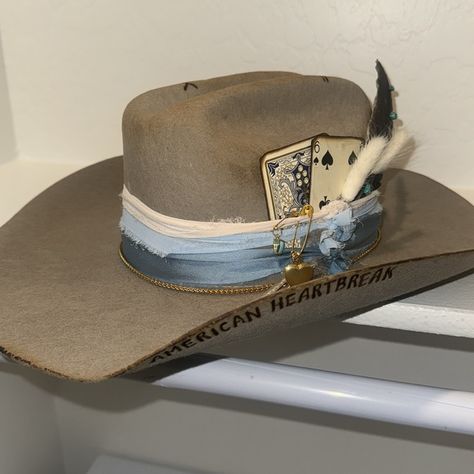 Brand New Never Worn Just Need Space Had Made From The Hat Bar In Scottsdale Very Cute Blue Tone And Grey Hat It’s Stamped American Heartbreak Perfect For A Fan Has The Cutest Charms On The Side 7 3/8 Cody James Cowboy Hats, Beth Dutton Cowboy Hat, Cowgirl Hat Styles, White Cowboy Hat Decorated, Cowboy Hats For Women Western Style, Fancy Cowboy Hat, Cool Cowboy Hats, Custom Cowboy Hats Women, Custom Cowboy Hat Ideas