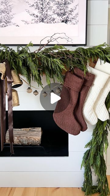 Katie Bowen on Instagram: "…the stockings were hung 🌲  …finally! 🤭 I Loved the original look & balance of the three antique bells on both sides of the mantel; but where would the stockings go?! After playing around I found a new look that made me love it still 🎁  What do you think?  Holiday Decor | holiday home | Christmas home | Christmas Decor | Christmas Mantle | Christmas Mantel | fireplace | living room | neutral Christmas decor | neutral home | organic modern   #fireplacedesign  #christmasmantle  #christmasmantel  #livingroomdesign  #organicmodern  #neutralchristmas  #christmasstockings" No Mantle Stocking Idea, Organic Modern Christmas Decor, Stockings On Mantle, Minimalist Mantle, Christmas Decor Neutral, Living Room Neutral, Mantle Christmas, Home Christmas Decor, Fireplace Living Room