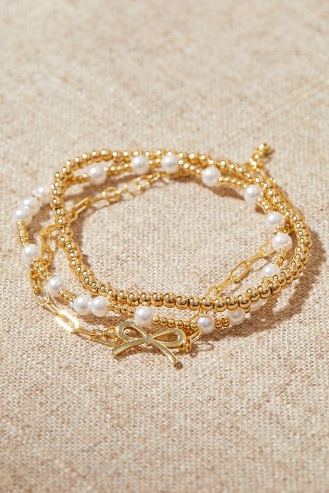 18K Gold Beaded Bow Bracelet Pack in Gold | Altar'd State Birkenstock Clogs, Gold Bracelets Stacked, Beaded Bow, Preppy Jewelry, Pretty Jewelry Necklaces, Bracelet Pack, Bow Bracelet, Jewelry Accessories Ideas, Jewelry Essentials